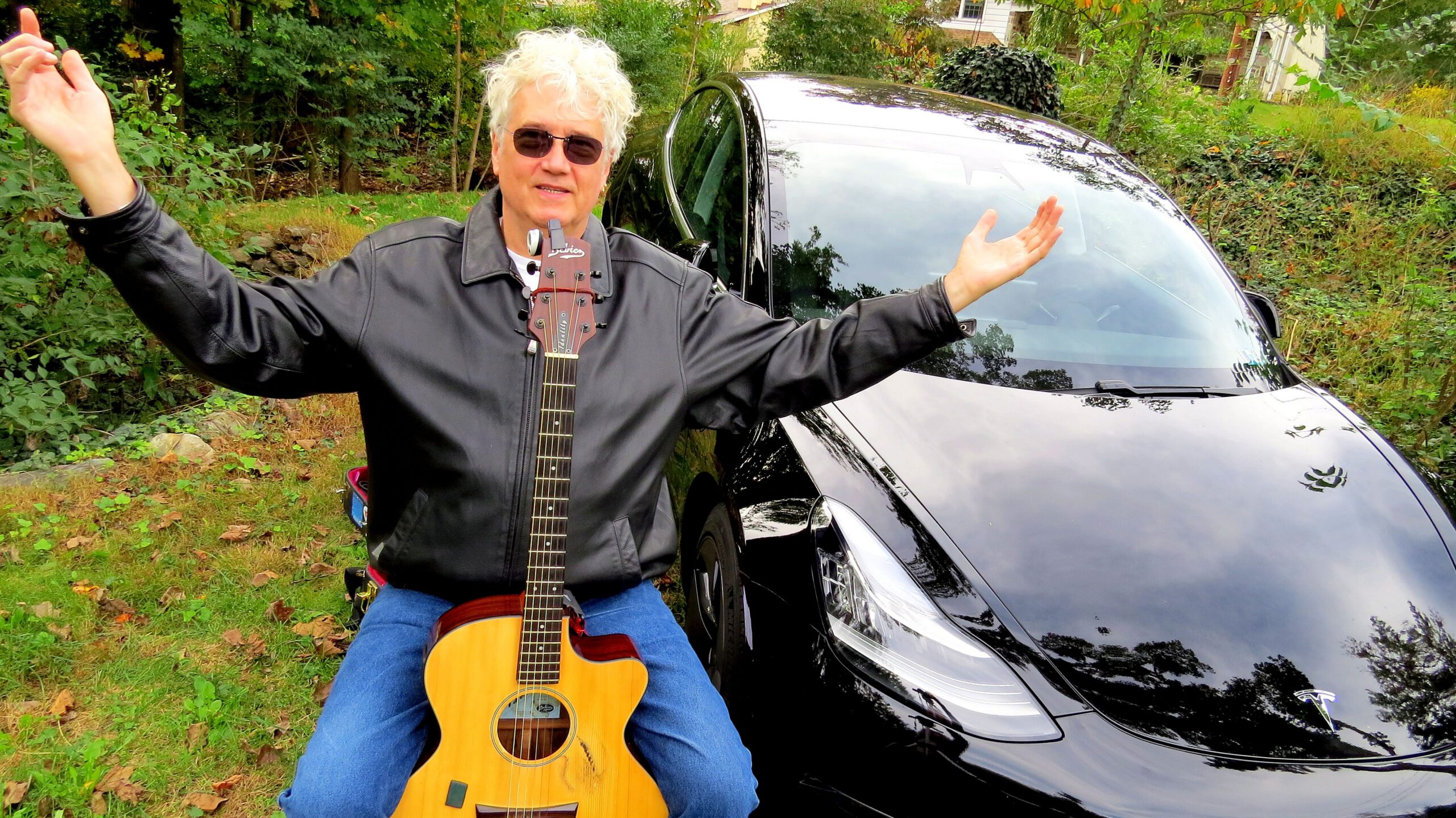 Rick Denzien shows off his Model 3 that drove almost 13,000km across American and back. Supplied.