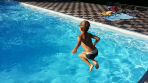 Which uses more electricity per year: an electric car or a swimming pool?