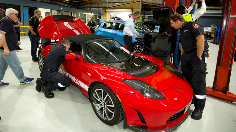 The 2011 Tesla Roadster unergoes a safety inspection prior to the race this weekend. Supplied