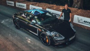 Mark Webber powers up with all-electric Porsche Taycan at Goodwood