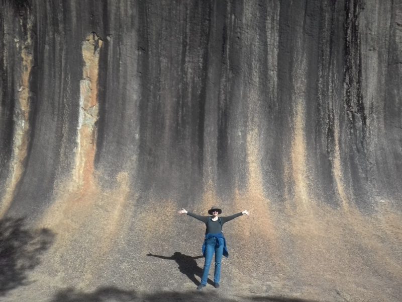 Kat poses in front of Hyden’s Wave Rock. Supplied