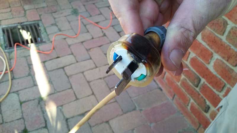 Fig. 4: Internal melting of one pin of a 3 pin, 15A plug used for EV charging