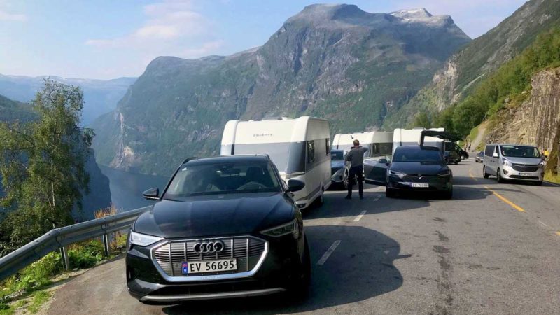 tesla and audi e-tron pulling caravan