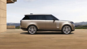 Jaguar unveils electric Range Rover, but will pay Tesla for carbon credits