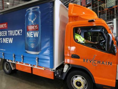 An all-electric Fuso eCanter trials delivering beer for Bevchain. Source: Linfox