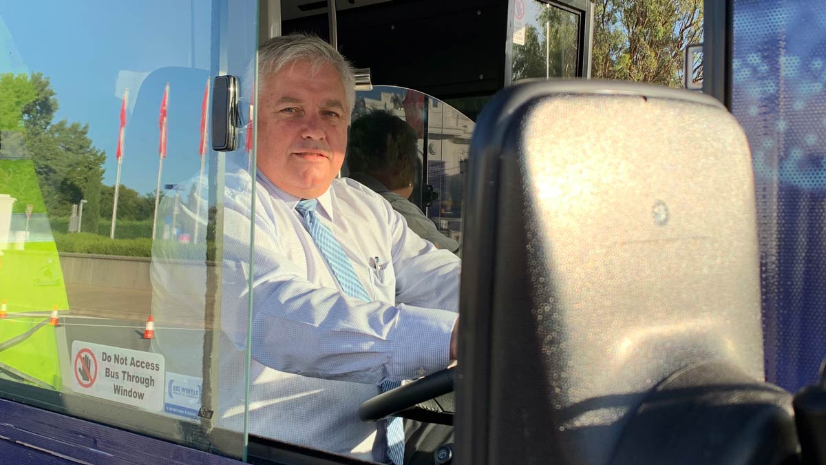 Senator Rex Patrick behind the wheel of an electric bus. Supplied