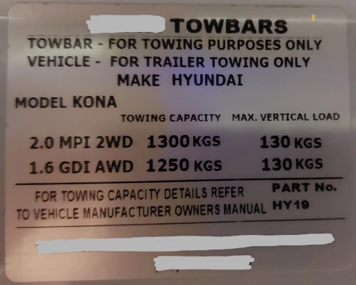 Sticker on the car from the towbar installer which points to owners manual