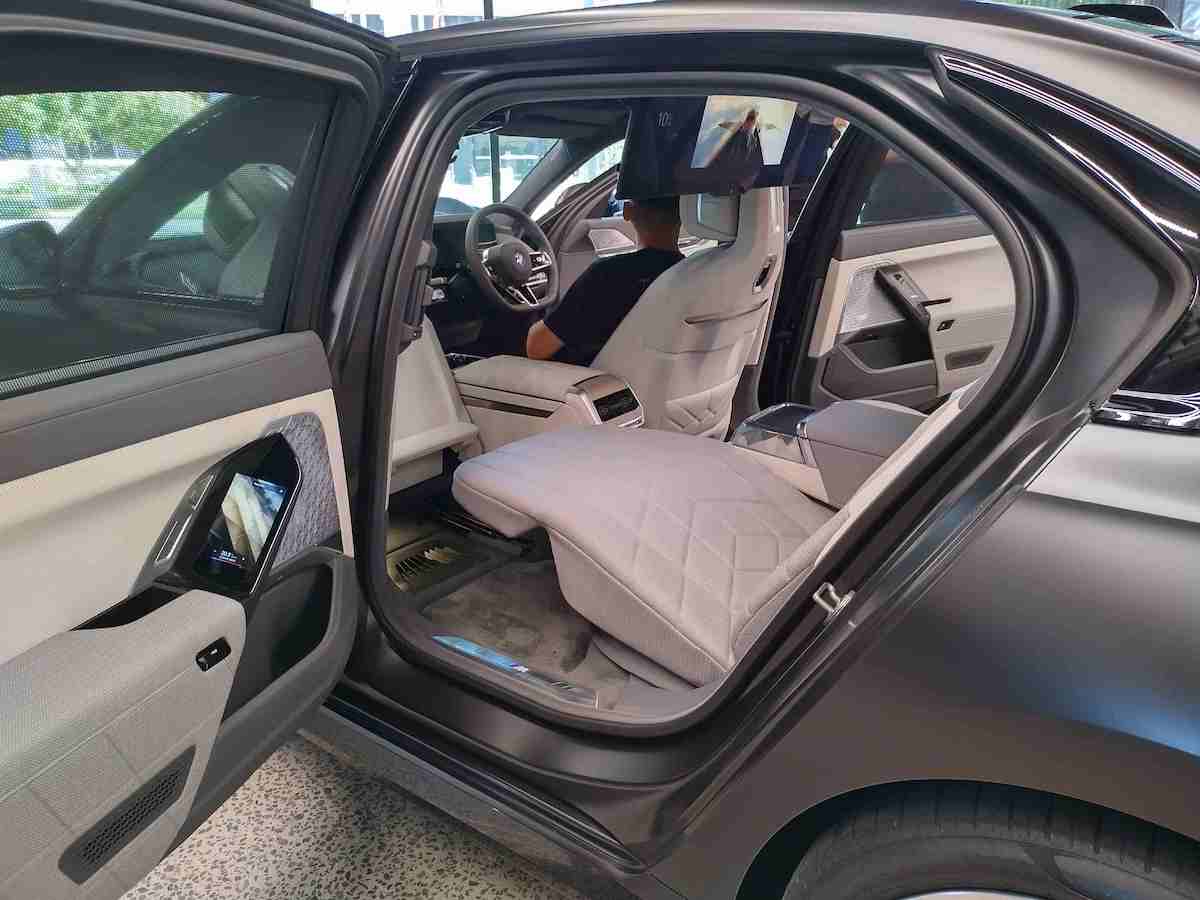 BMW I7 connoisseur lounge rear seating extended.