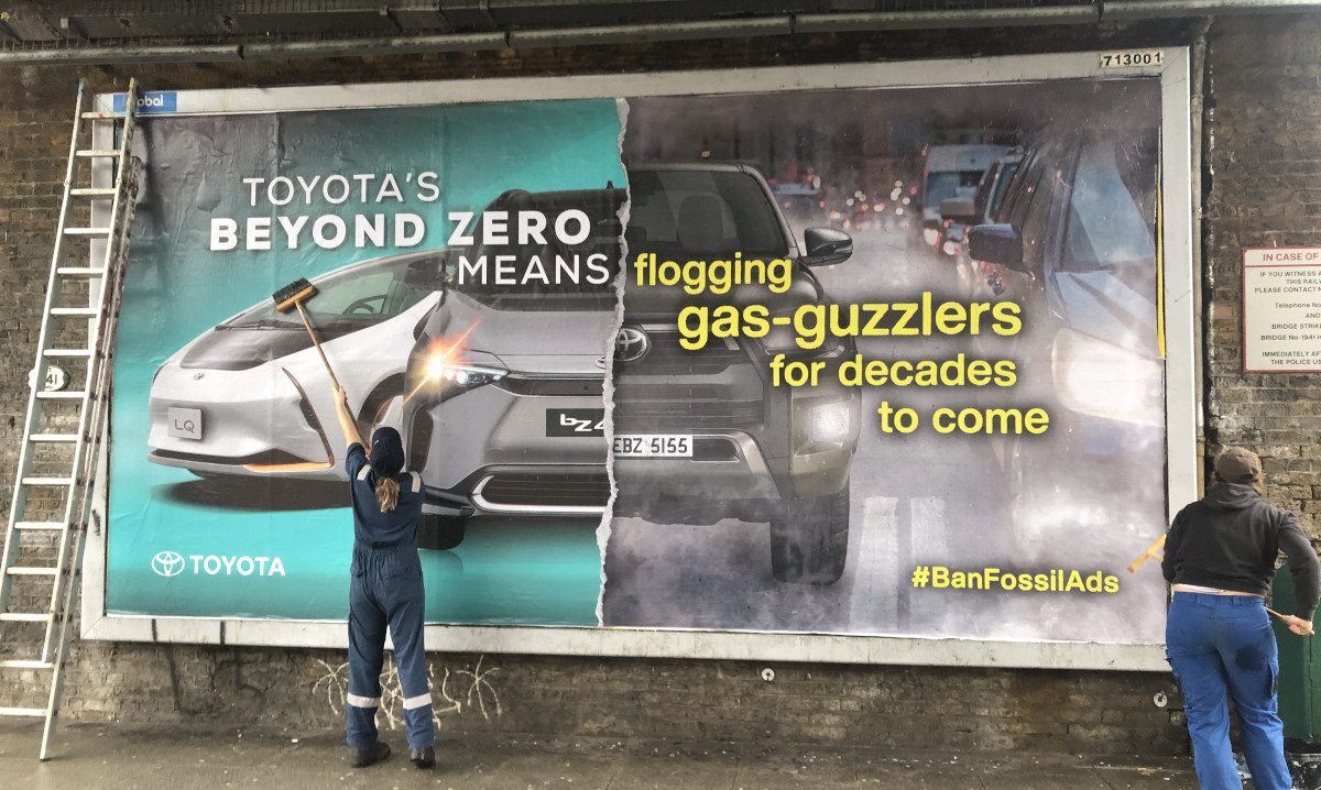 Hacked billboard exposing Toyota's greenwashing