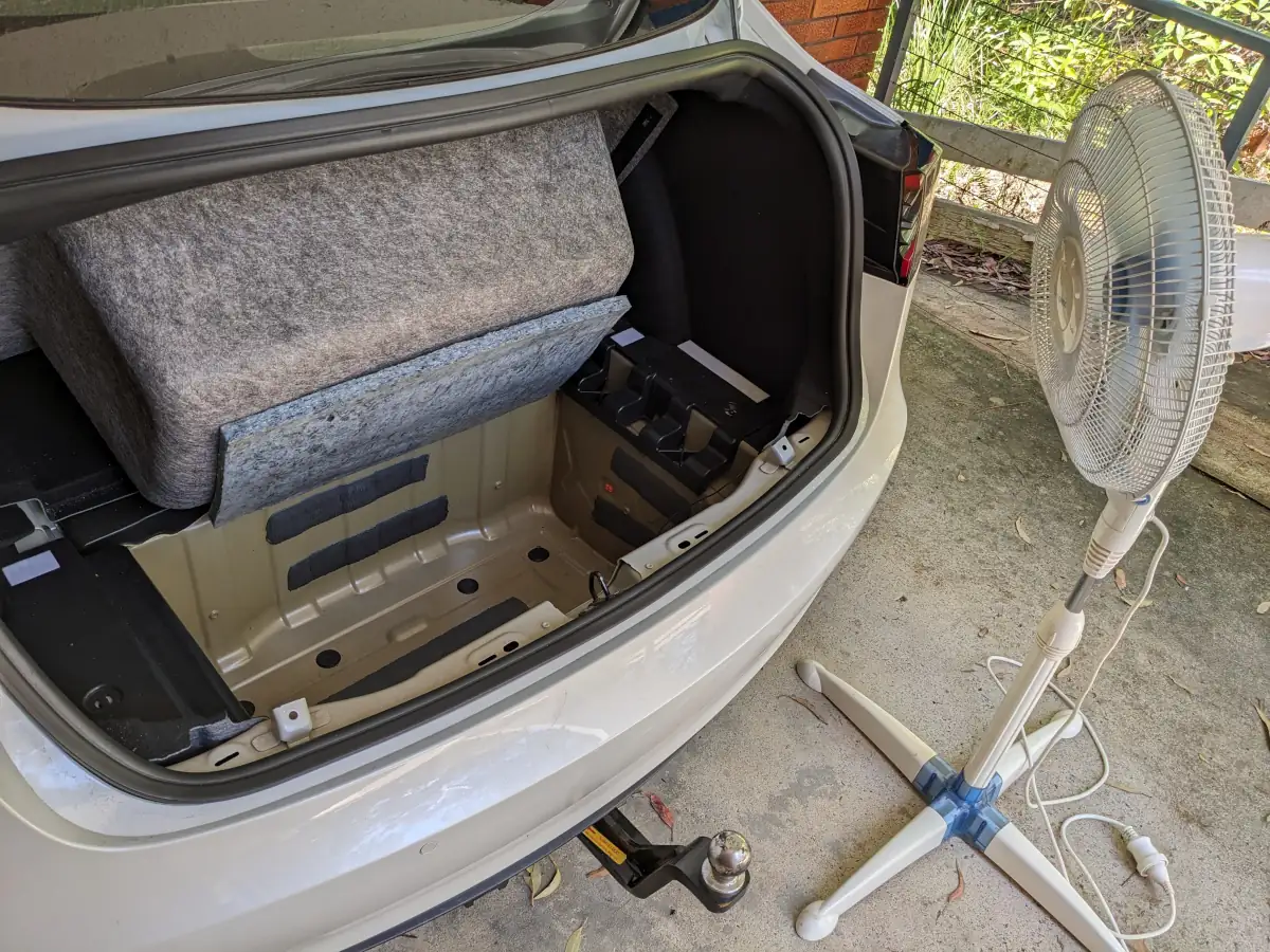 Drying out the boot of the Model 3. Image: Tim Eden