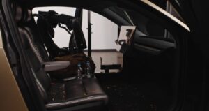 This robot sucks: Tesla shows off its new robot product for cleaning robotaxi