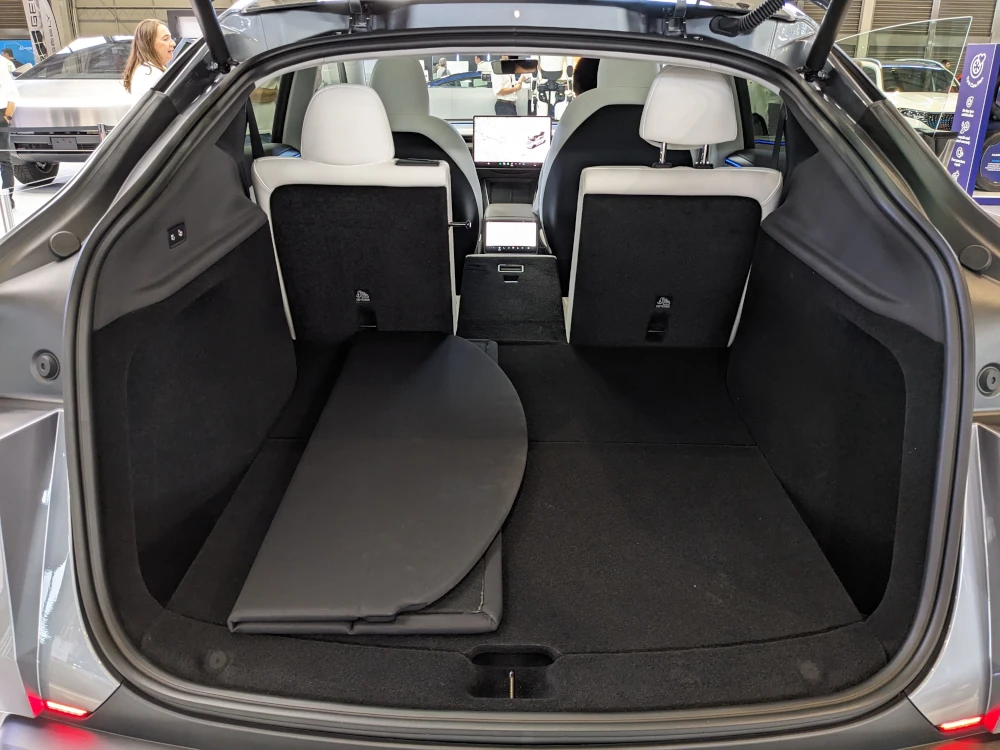 Middle seat of a Model Y second row folded down at Everything Electric. Image: Tim Eden