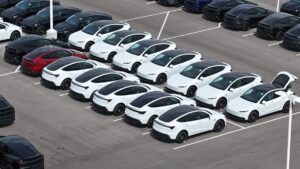 Tesla begins production of lower cost EV, with first customer deliveries imminent