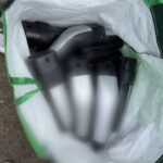 Man charged with damaging nearly a dozen EV charging stations and stealing Tesla Supercharger plugs