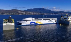 “Extraordinary moment:” World’s largest electric ferry, made in Australia, loaded on cargo ship for trip to South America